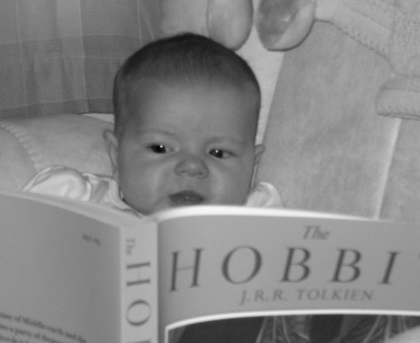 Reading the "Hobbit" at six months.