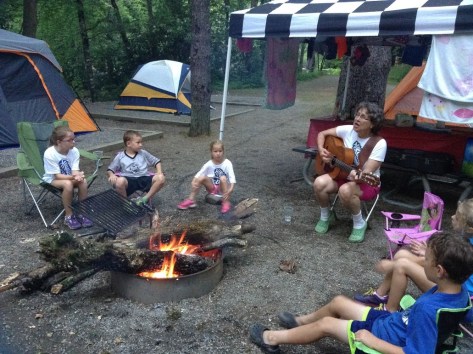 Nana singing around campfire